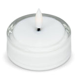 White LED tea light with a flickering flame inside a clear glass Maxilight holder.
