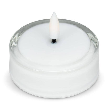 White LED tea light with a flickering flame inside a clear glass Maxilight holder.