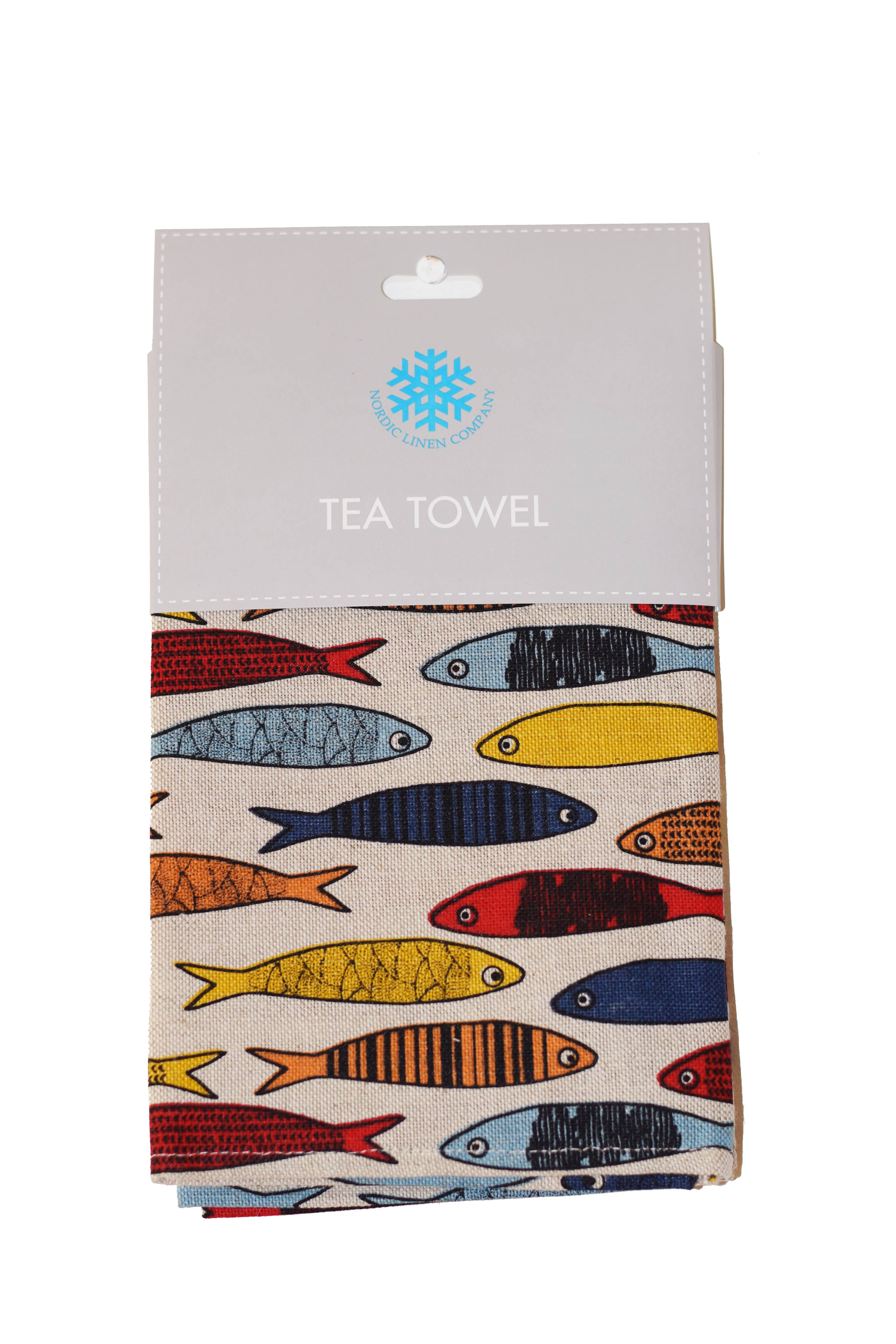 The Tea Towel: Fish Pattern is a vibrant linen-cotton blend, neatly folded and packaged in a gray cardboard header with the logo and Tea Towel text.