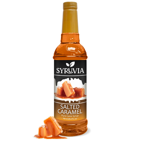 A bottle of Syruvia Syurp: Salted Caramel Syrup Pure Cane Sugar is shown with caramel pieces in front, set against a white background.