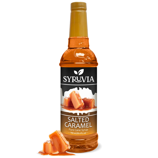 A bottle of Syruvia Syurp: Salted Caramel Syrup Pure Cane Sugar is shown with caramel pieces in front, set against a white background.