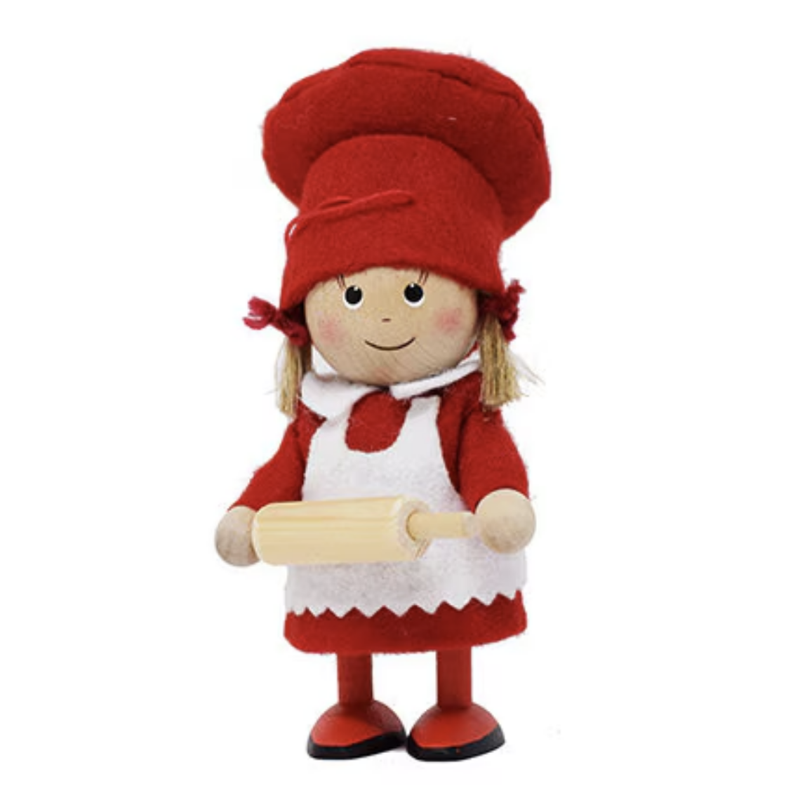 This charming wooden figurine, named "Baker Girl with Rolling Pin," is dressed in a red hat and dress with a white apron, holding a rolling pin. It's perfect as a Christmas decoration and encapsulates the delightful essence of handmade Scandinavian gnomes.