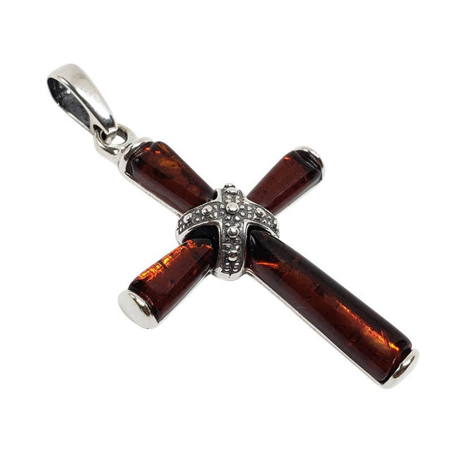 A .925 sterling silver cross pendant featuring genuine Baltic amber inlays and a detailed central design.