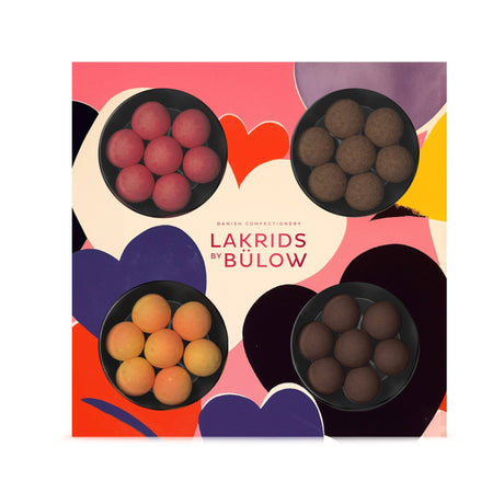The Lakrids by Bülow LOVE 4-Flavor Gift Box (6.2oz) features Danish chocolate-coated licorice in four gourmet varieties, beautifully arranged in a heart-patterned limited edition box.