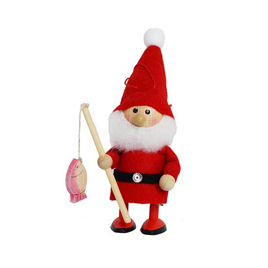 The Figurine: Santa Fisherman with Pole & Fish features a handcrafted Santa in a red outfit, holding a fishing pole with a pink fish, making it the perfect Christmas tree decoration.