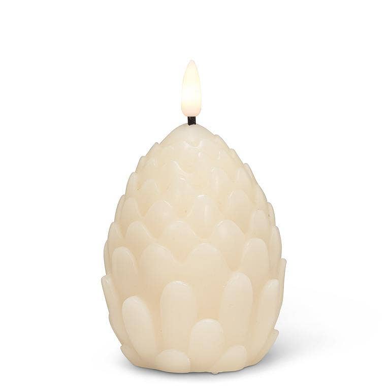 An ivory LED candle designed like a pine cone with a textured surface and a small flame on top, standing 4 inches tall.