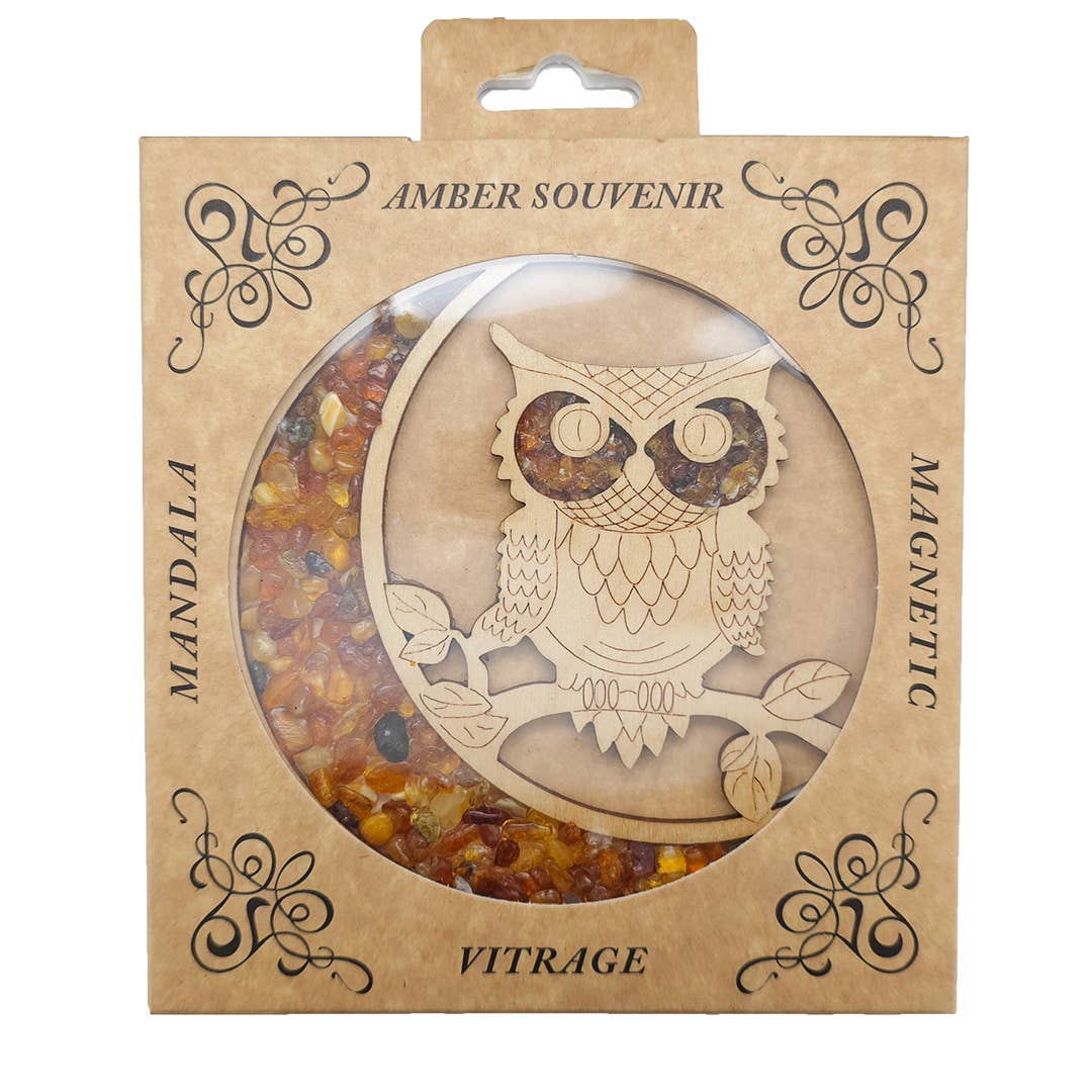 Box with an owl-shaped magnet titled Ornament: Owl Amber Suncatcher/Magnet, crafted from Baltic amber and wood. The decorative brown packaging features mandala patterns, making it a charming keepsake labeled Amber Souvenir and Magnetic.