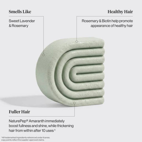 A pale green, curved shampoo bar—the Hair: Rosemary & Biotin Volumizing Hair Conditioner Bar 2.7 oz by KITSCH—is featured with text highlighting its calming lavender and rosemary scent. Specially formulated as a rosemary biotin conditioner for fine hair, it harnesses the power of NaturePep Amaranth to deliver visibly fuller, healthier hair after just 10 uses—making this KITSCH volumizing conditioner bar an ideal addition to your daily routine.