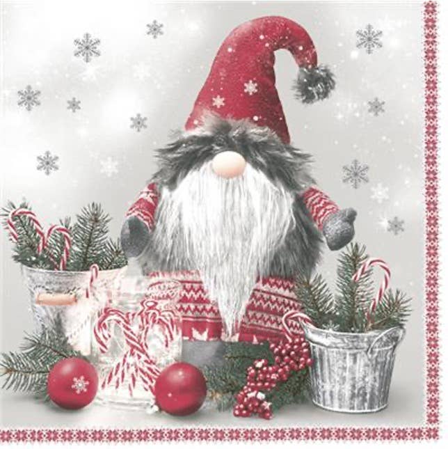 A gnome with a long white beard and red hat sits among pine branches, ornaments, and pails with snowflakes—ideal for festive table settings with Napkins: Scandinavian Gnome Lunch Napkins - 20 Pkg Christmas Paper Napkins.