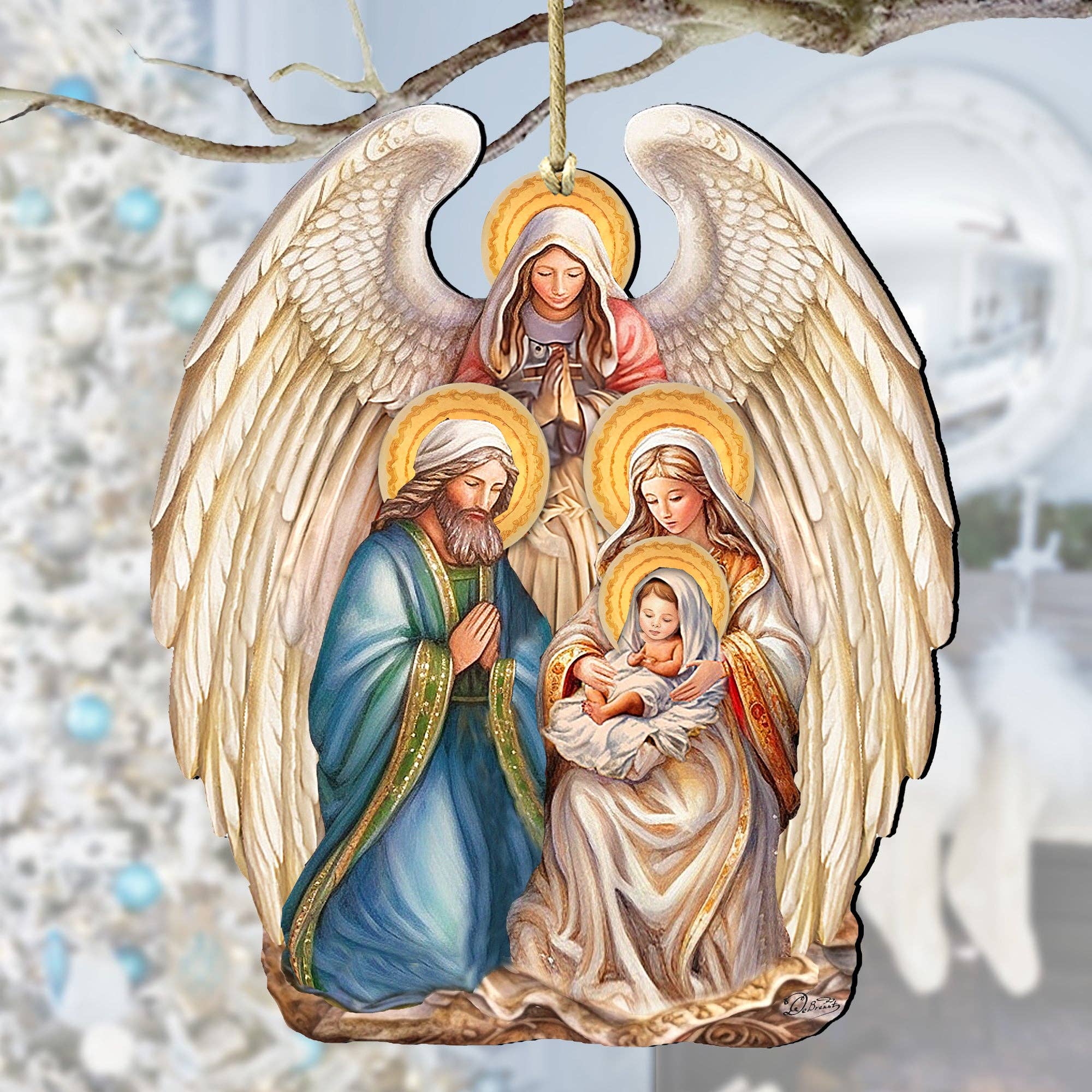 This exquisite Christmas decor, handcrafted as a religious keepsake, features the Nativity with Angel Wooden Ornament by G.Debrekht. It showcases an angel and three haloed figures, including one gently cradling a child, against a softly blurred Christmas tree backdrop.