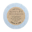 The blue Soap Lift, labeled High and Dry SOAP LIFT, is round with a brown label. Its eco-friendly, BPA-free bioplastic, made in the USA under the name Round A Bout Soap Lift Soap Saver.