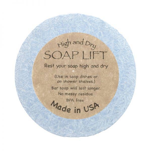 The blue Soap Lift, labeled High and Dry SOAP LIFT, is round with a brown label. Its eco-friendly, BPA-free bioplastic, made in the USA under the name Round A Bout Soap Lift Soap Saver.