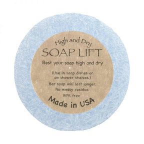 The blue Soap Lift, labeled High and Dry SOAP LIFT, is round with a brown label. Its eco-friendly, BPA-free bioplastic, made in the USA under the name Round A Bout Soap Lift Soap Saver.