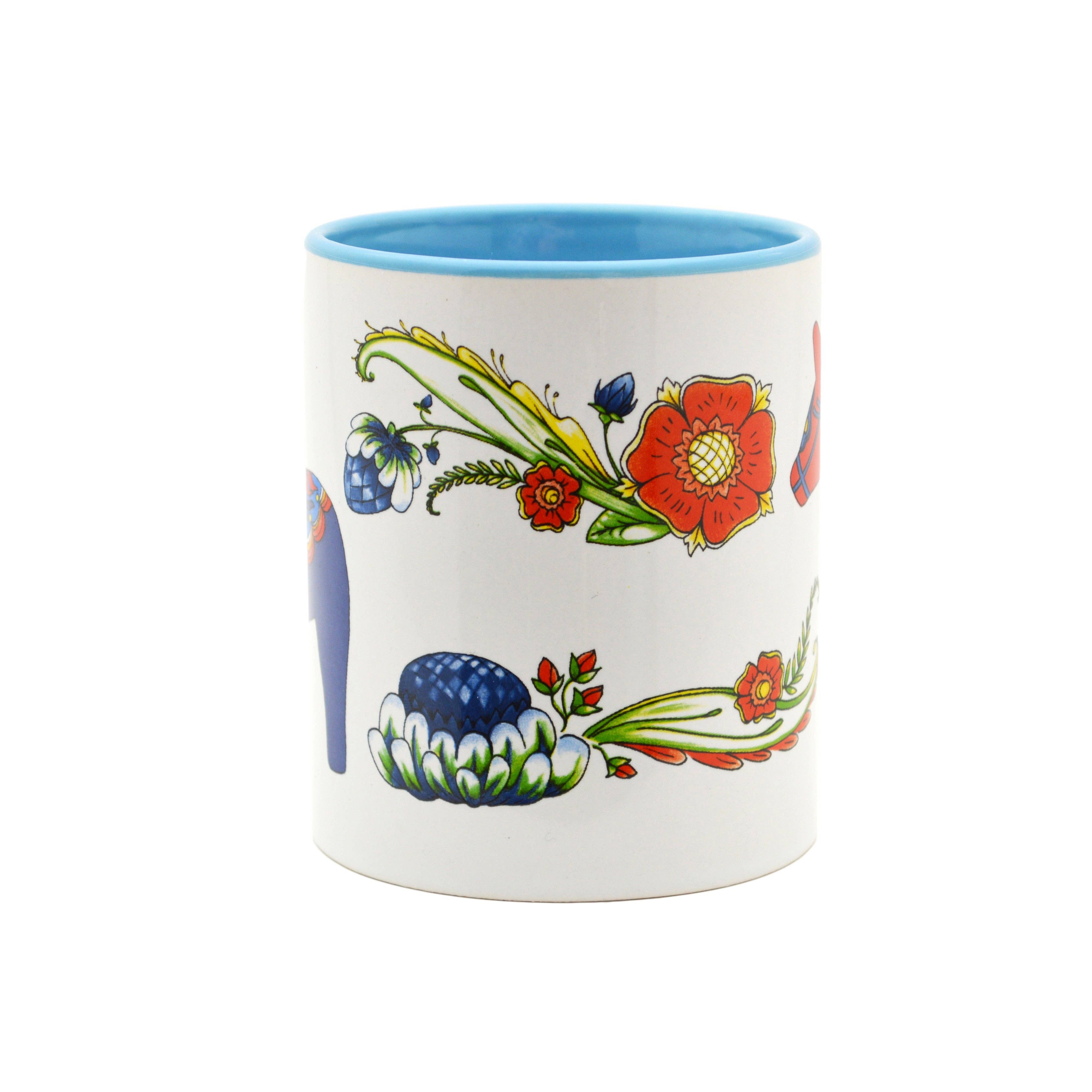 Ceramic coffee mug featuring a red Dala horse design and blue interior, inspired by Scandinavian folk art.