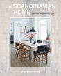 Cover of Book: Scandinavian Home Interiors Inspired by Light by Niki Brantmark, depicting a minimalist dining room with wooden chairs and a pendant lamp, highlighting elegant Scandinavian interiors filled with natural light.