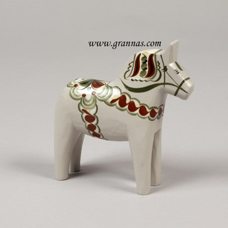 A gray Dala Horse named Anniversary Horse Anders, featuring red, yellow, and green Kurbits patterns, crafted by Grannas, brings a touch of vibrant tradition.