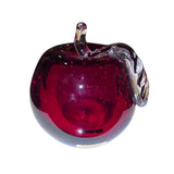 The Decor: Red Apple 3 Tall Mouth Blown Glass from Mantorp Sweden features a red glass apple with a clear glass stem and leaf, expertly crafted and shown against a white background.
