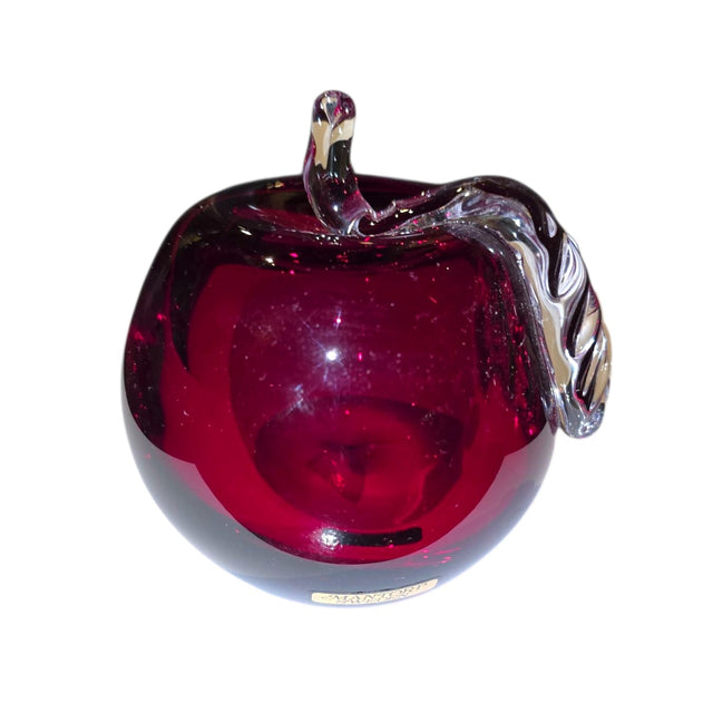 The Decor: Red Apple 3 Tall Mouth Blown Glass from Mantorp Sweden features a red glass apple with a clear glass stem and leaf, expertly crafted and shown against a white background.