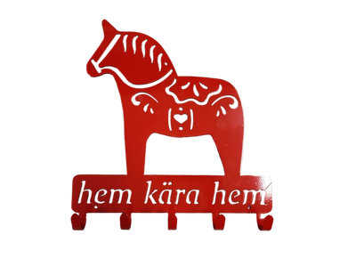 Coat Hooks: Hem Kära Hem Dala Horse—a red wall hook shaped like a Dala horse with white patterns and “hem kära hem” text, ideal for Swedish home decor or as a unique coffee mug rack.