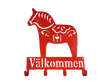 The Coat Hooks: Valkommen Dala Horse Sign is a red metal wall hook shaped like a Swedish Dala horse with "Välkommen" beneath—ideal as a unique entryway sign or for hanging coats.