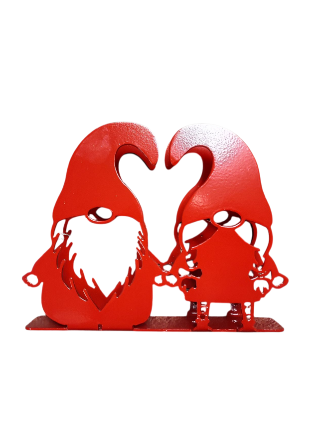 Add Scandinavian charm to your table with this red-painted laser cut metal napkin holder, featuring two Tomte gnomes with large hats and beards—perfect as a decorative or functional napkin or letter holder.