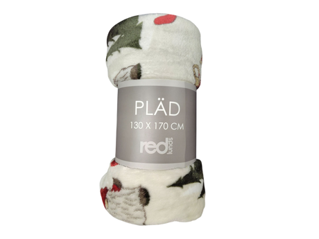 A rolled-up Redlunds Noel Throw Blanket (130 x 170 cm) with a festive Nordic design, labeled on the packaging.