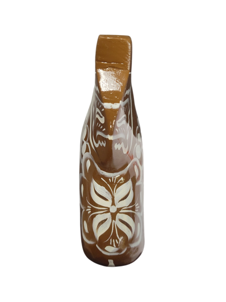 The Dala Horse: Swedish Dala Horse in brown with white kurbits is a handcrafted ceramic piece from Sweden, featuring a floral decorative design and traditional artistry.