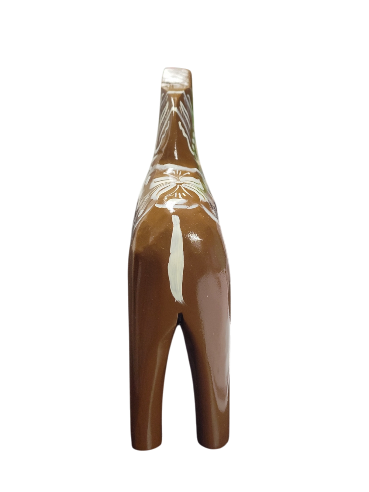 The Dala Horse: Swedish Dala Horse Brown with White Kurbits is a handcrafted ceramic figurine from Sweden, featuring white decorative patterns—a charming folk symbol, shown from the back against a white background.
