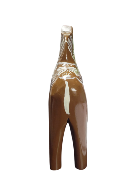 The Dala Horse: Swedish Dala Horse Brown with White Kurbits is a handcrafted ceramic figurine from Sweden, featuring white decorative patterns—a charming folk symbol, shown from the back against a white background.