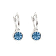These stunning hoop silver earrings are designed with Denim Blue gemstones that shimmer like a calm sea.