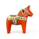 A handcrafted red Swedish Dala Horse, available in various sizes, is shown against a white background.