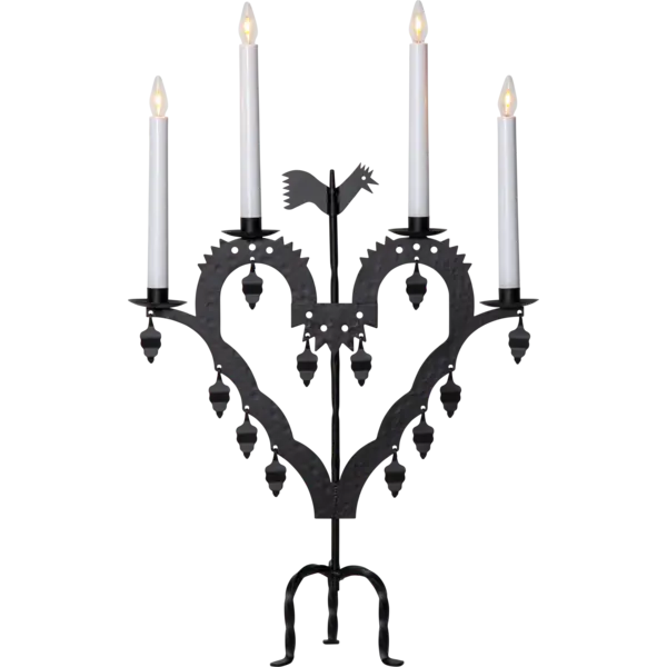 The Candelabra: Star Trading Metal Candlestick El-Tupp features a black metal, heart-shaped design with four lit white candles and decorative hanging elements, perfect for adding a warm Christmas atmosphere to your home.