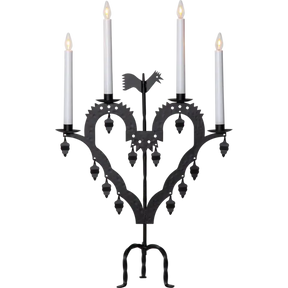 The Candelabra: Star Trading Metal Candlestick El-Tupp features a black metal, heart-shaped design with four lit white candles and decorative hanging elements, perfect for adding a warm Christmas atmosphere to your home.