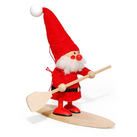 The "Santa on Paddle Board" figurine, a meticulously crafted wooden piece featuring Santa Claus wielding a paddle while atop a surfboard, serves as an enchanting Christmas tree ornament. Its playful design evokes the charm of Scandinavian gnomes enjoying the festive season.