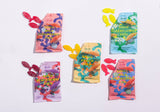 A vibrant bag of BonBon Sour Elderflower Fish (150g) Swedish Candy, featuring vegan and gluten-free sour fruit-flavored gummies shaped like fish, with colorful candies spilling out beside the bright packaging.