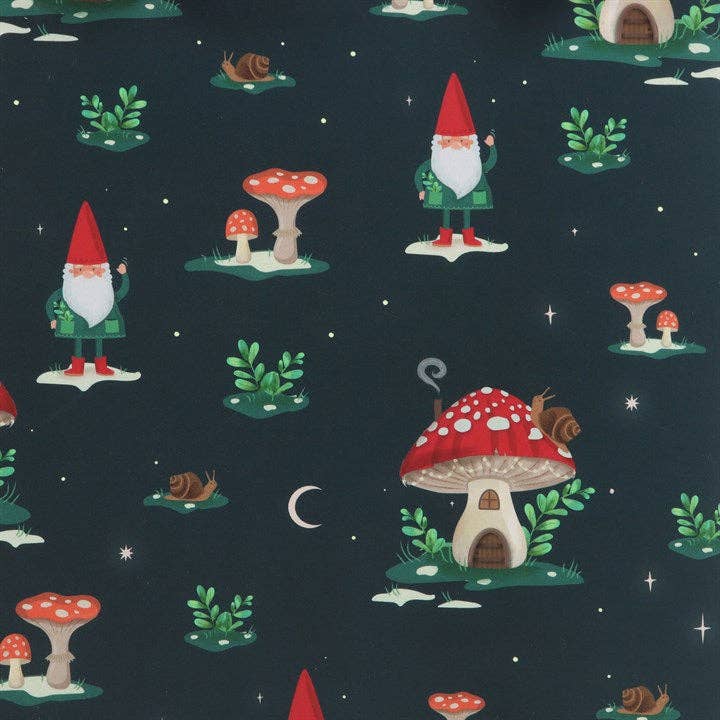 The "Gnome Sweet Gnome" gift bag measures 7.5" wide by 9" high and 3.5" deep, and showcases a winter forest-inspired design with gnomes, red-capped mushrooms, snails, green plants set against a dark background adorned with small stars and a crescent moon.