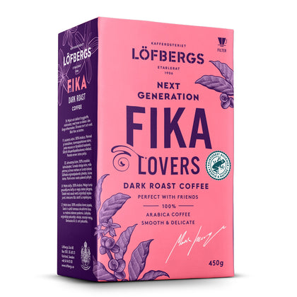 A 15.87 oz box of Lofbergs Fika Dark Roast Ground Coffee, a Swedish blend of 100% arabica beans, Rainforest Alliance-certified, with purple coffee plant art on a pink background.