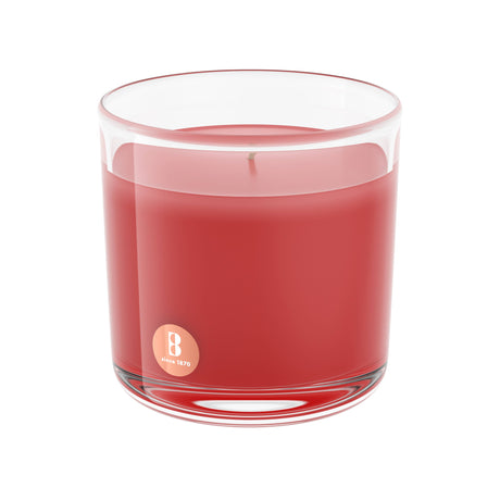 Displayed against a white background, the Pomegranate Scented Candle - 3.75 x 3.75 Inches - 43 Hours features a high-quality red design in a clear glass container with an elegant logo, exuding the delightful aroma of pomegranate.