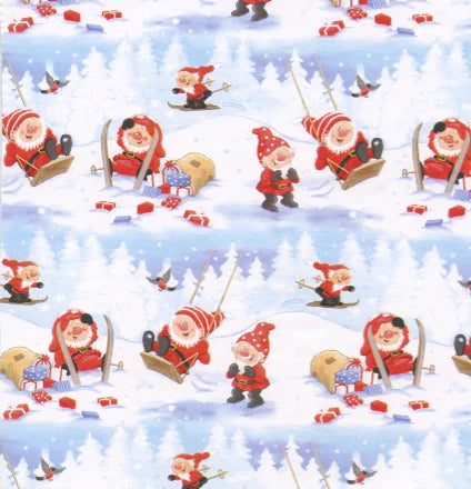 Gift Wrap: Tomtar Playing in the Snow Gift Wrap or Craft Paper features gnomes in red outfits skiing, sledding, and carrying gifts among snowy trees and birds—a charming Scandinavian-inspired paper for wrapping or crafts.