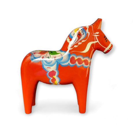 The Dala Horse: Red Swedish Dala Horses – Handcrafted in Sweden (Various Sizes) displays authentic Swedish craftsmanship, featuring vibrant decorative patterns and a traditional red finish, proudly shown on a white background.