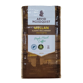A 17.6oz package of Arvid Nordquist Classic Mellanrost Ground Coffee, made with 100% Arabica beans and certifications, featuring People, Planet, Coffee on the front. This Swedish coffee is medium-roasted for a delightful experience.