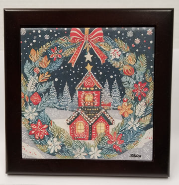 The "Tile: Christmas Wreath Winter House" features a red house encircled by a festive wreath with a bow, set amidst a snowy forest background. The wood frame enhances the winter scene, introducing an additional layer of warmth and elegance to this captivating artwork.