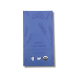 Purple chocolate wrapper with “Honey Lavender” text, floral patterns, and icons indicating organic, soy-free, gluten-free, and palm oil–free.