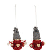 Pair of hanging Christmas gnome ornaments with red sweaters featuring heart buttons, gray knit hats, and attached string loops.