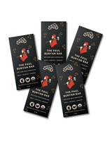 Six chocolate bar wrappers with black backgrounds and brown accents, each labeled The Paul Bunyan Bar and showing an illustrated lumberjack holding an axe.