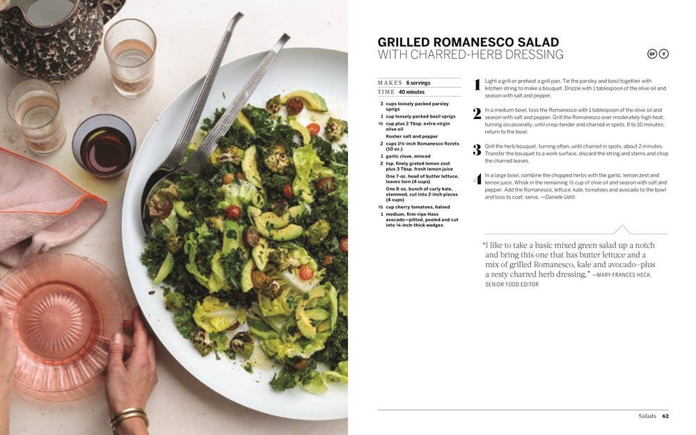 Grilled Romanesco salad with charred-herb dressing sits invitingly beside a glass of rosé wine. This delightful dish, featured in the book "Potluck," excels in contemporary recipes, complete with detailed ingredients and preparation steps, making it perfect for any potluck dinner.