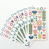 Juniper Blue's "Tuli" set includes 8 Scandinavian folk-art gift tags (2"x3.5") with envelopes, each featuring colorful fox and floral designs inspired by Scandinavian style.