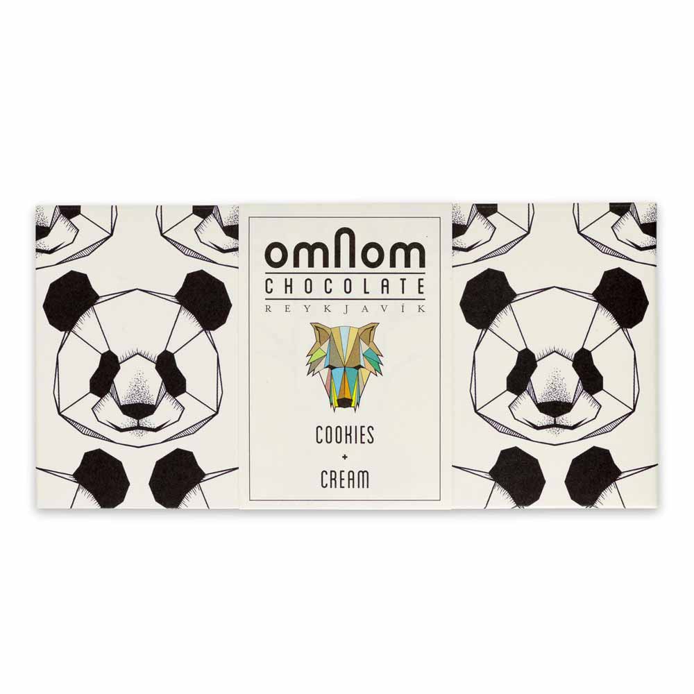 The OmNom White Chocolate with Chocolate Cookies 60g bar features geometric panda faces on its packaging and a central label, showcasing a delicious mix of white chocolate and chocolate cookies.