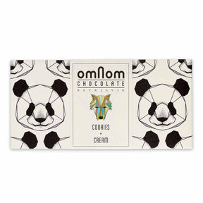 The OmNom White Chocolate with Chocolate Cookies 60g bar features geometric panda faces on its packaging and a central label, showcasing a delicious mix of white chocolate and chocolate cookies.