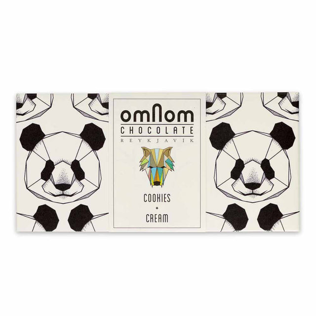 The OmNom White Chocolate with Chocolate Cookies 60g bar features geometric panda faces on its packaging and a central label, showcasing a delicious mix of white chocolate and chocolate cookies.